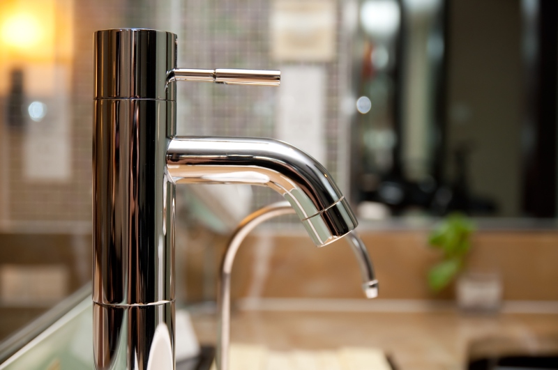 Leaking tap being repaired in South Norwood